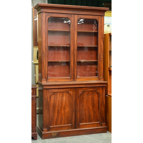 Appraisal: A Victorian mahogany bookcase the upper part enclosed by glazed