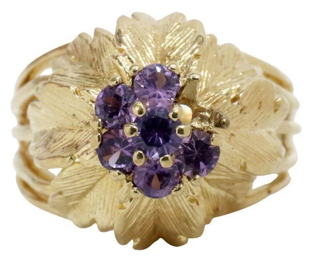 Appraisal: Estate kt yellow gold ring floriform setting round faceted transparent