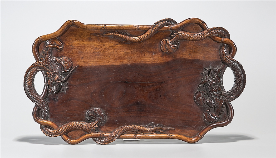 Appraisal: Chinese carved hard wood tray with dragons in relief forming