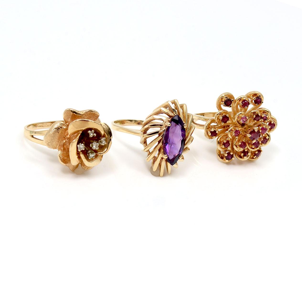 Appraisal: LOT OF GEMSTONE RINGS Three K rings contain amethyst rubies