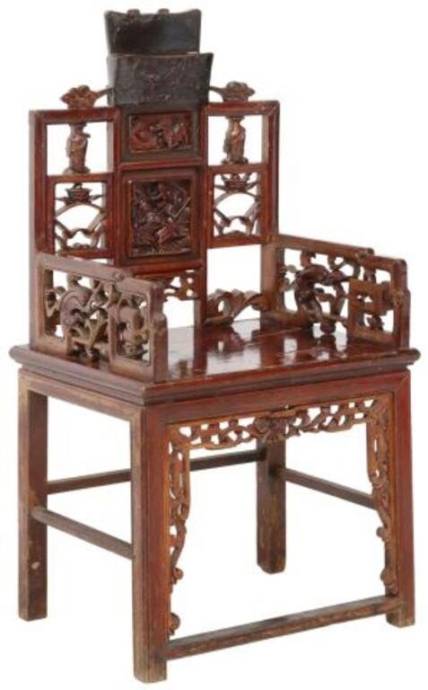 Appraisal: Chinese highly carved wood armchair having lacquered finish square back