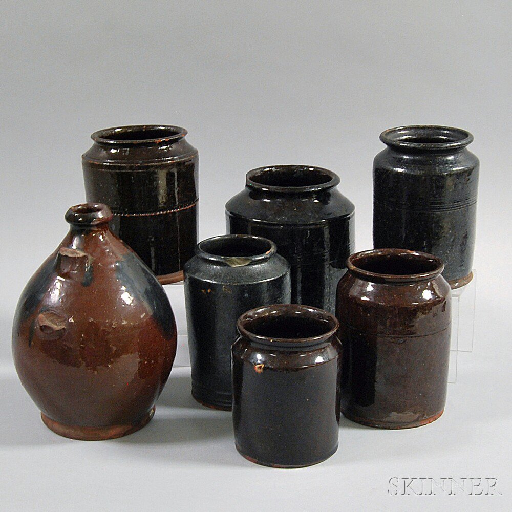 Appraisal: Seven Redware Vessels th century six jars two with reeded