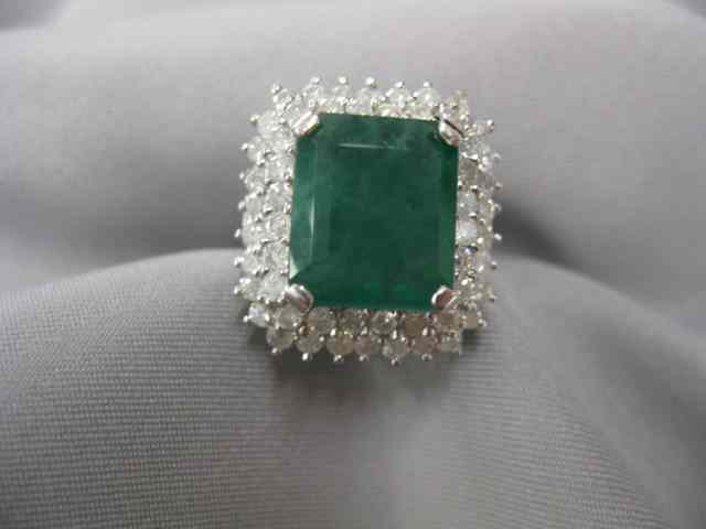 Appraisal: Emerald Diamond Ring carat rectangulargem surrounded by diamonds totaling carat