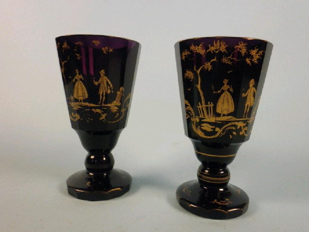 Appraisal: A pair of late thC Bohemian purple glass facetted goblets