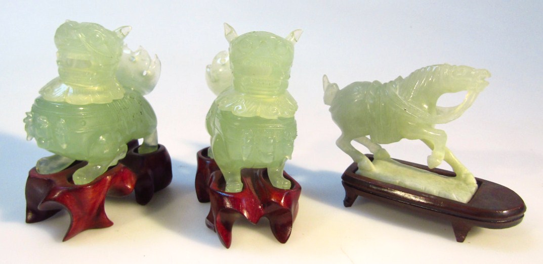 Appraisal: Various thC Chinese green jade carvings to include a pair