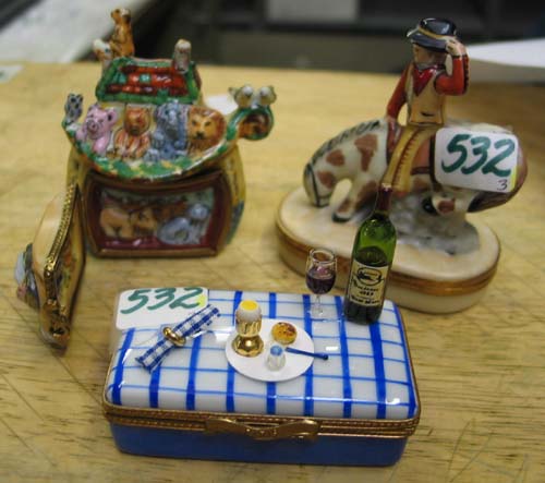 Appraisal: THREE LIMOGES PORCELAIN PILLBOXES DISPLAY The pill boxes of a