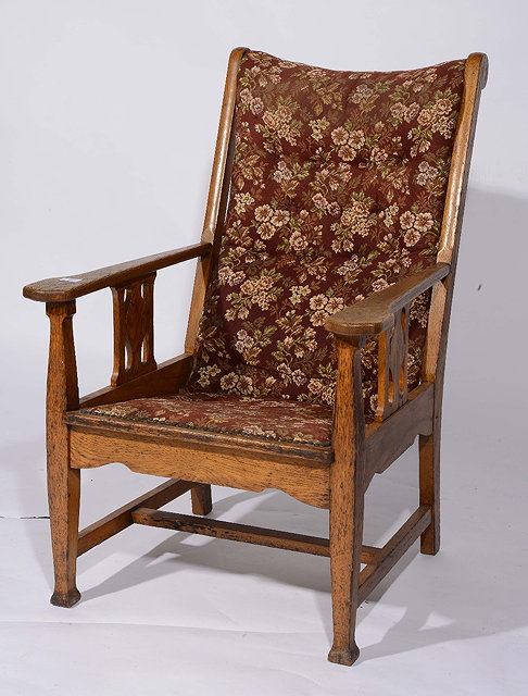 Appraisal: An Arts Crafts oak armchairpossibly Heals with button back