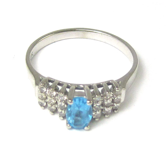 Appraisal: BLUE TOPAZ DIAMOND AND TEN KARAT GOLD RING The white