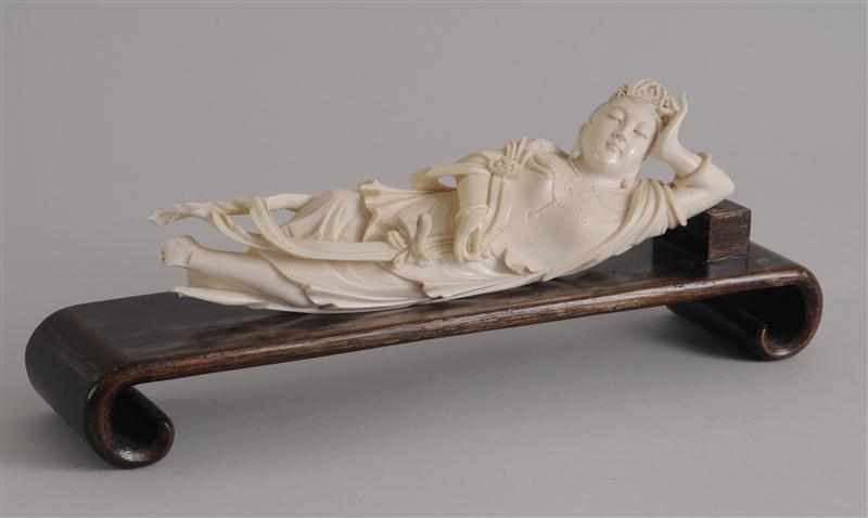 Appraisal: CHINESE CARVED IVORY RECLINING FIGURE Wearing diadem and beaded necklace