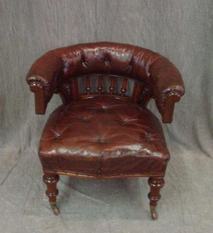 Appraisal: Victorian Leather Upholstered Chair Great patina on this demilune library