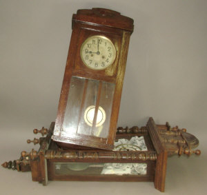 Appraisal: A Continental wooden cased regulator type wall clock the case