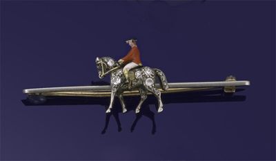 Appraisal: A diamond set horse and huntsman brooch The horse pav