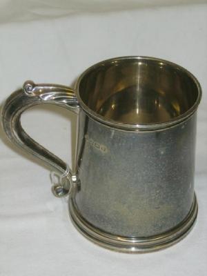 Appraisal: A TANKARD of tapering form with moulded rim leaf capped