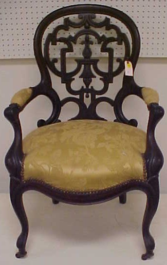 Appraisal: Victorian open armchair with elaborately pierced balloon back made of