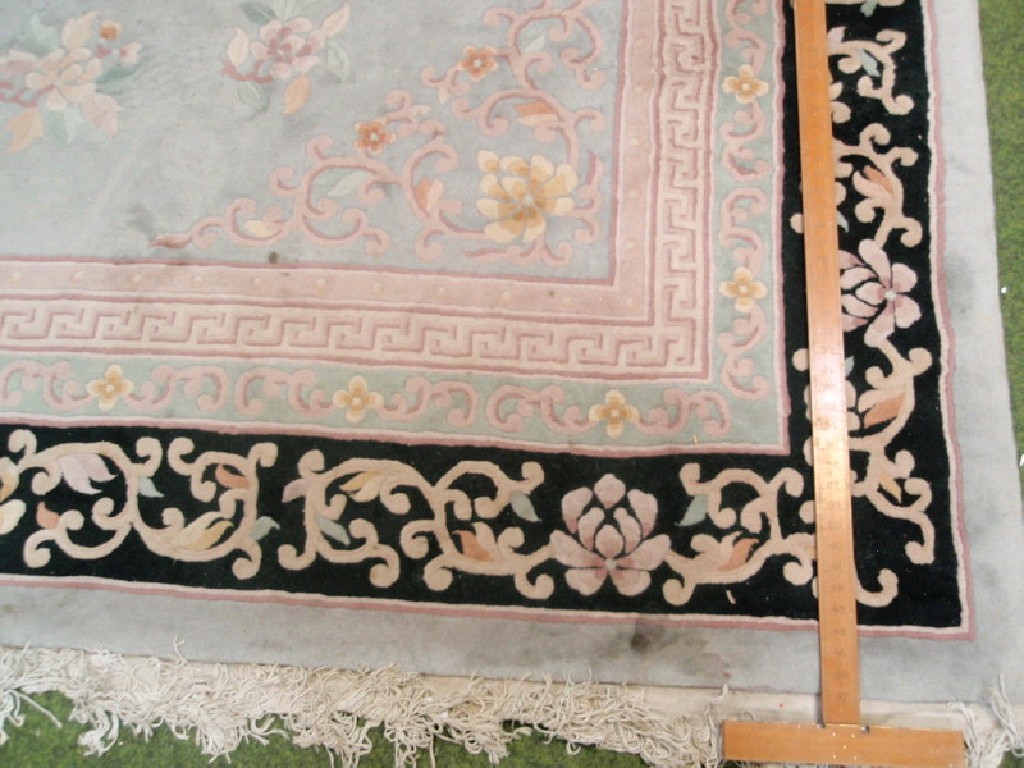 Appraisal: A large Chinese hand cut carpet blue ground