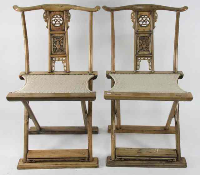 Appraisal: A pair of Chinese Ming style ash folding chairs the