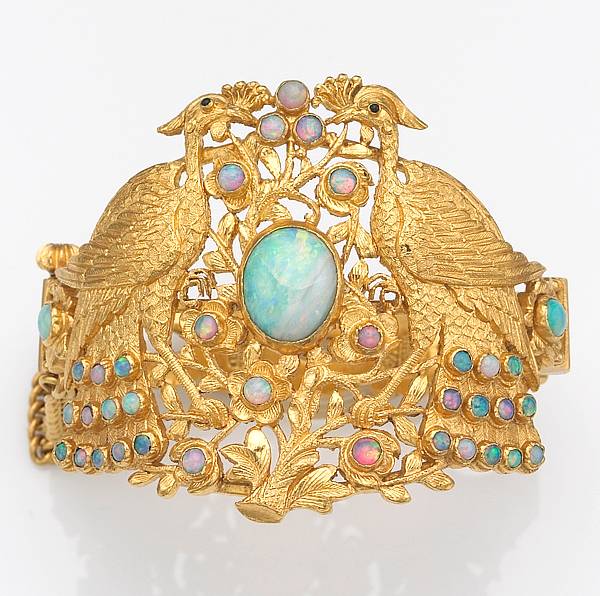 Appraisal: An opal and k gold bangle bracelet in a peacock