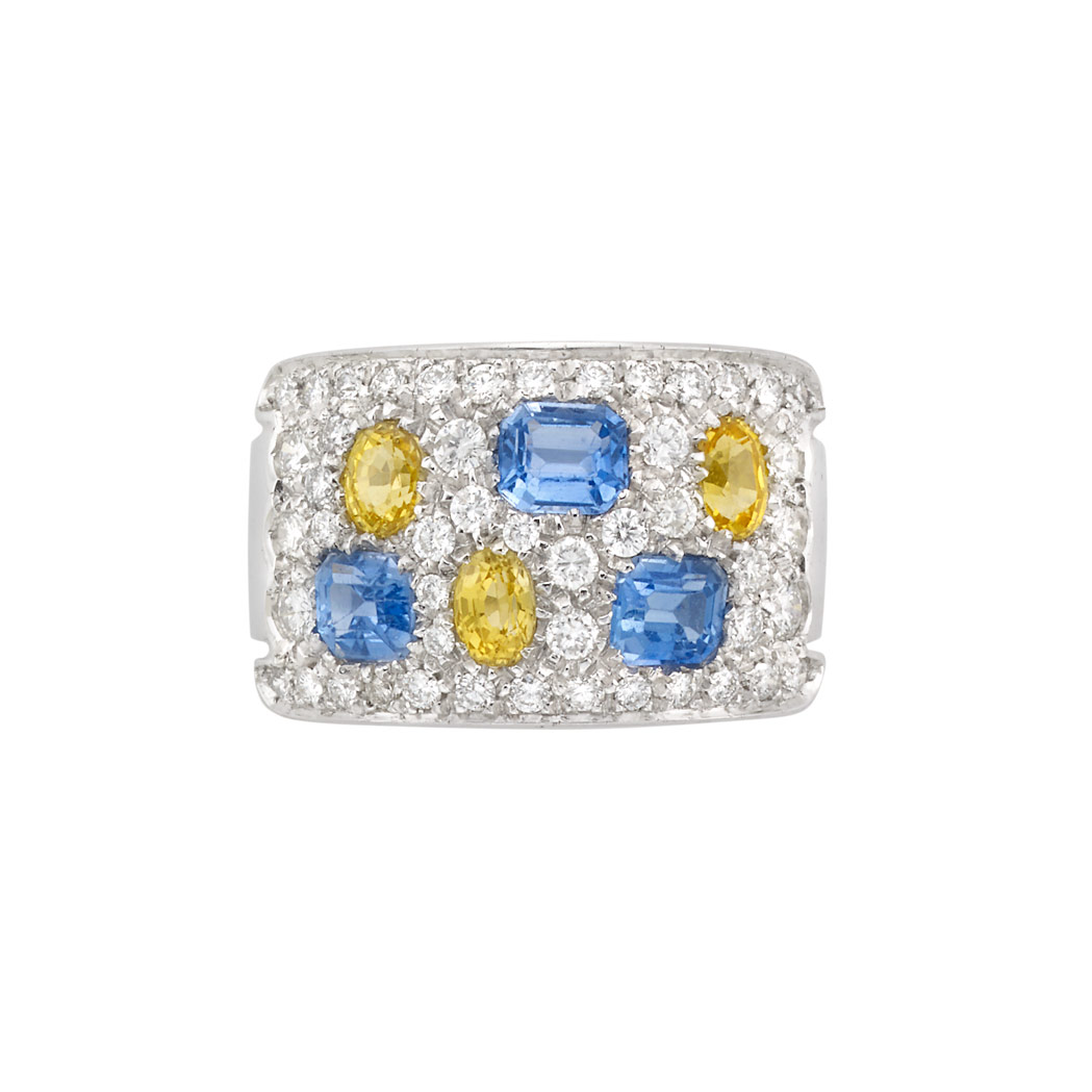 Appraisal: White Gold Diamond Sapphire and Yellow Sapphire Ring emerald-cut sapphires