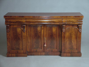 Appraisal: A Victorian mahogany sideboard the top with three frieze drawers