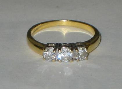 Appraisal: A THREE STONE DIAMOND RING the brilliant cut stones approximately