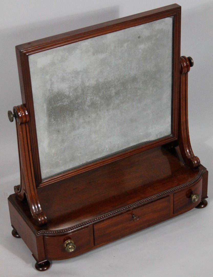 Appraisal: A Regency mahogany toilet mirror the rectangular moulded glass on