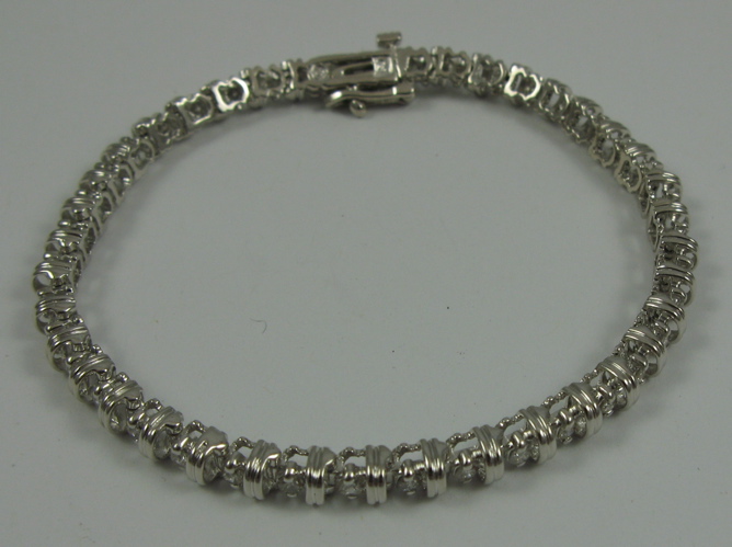 Appraisal: DIAMOND AND K WHITE GOLD BRACELET set with round-cut diamonds