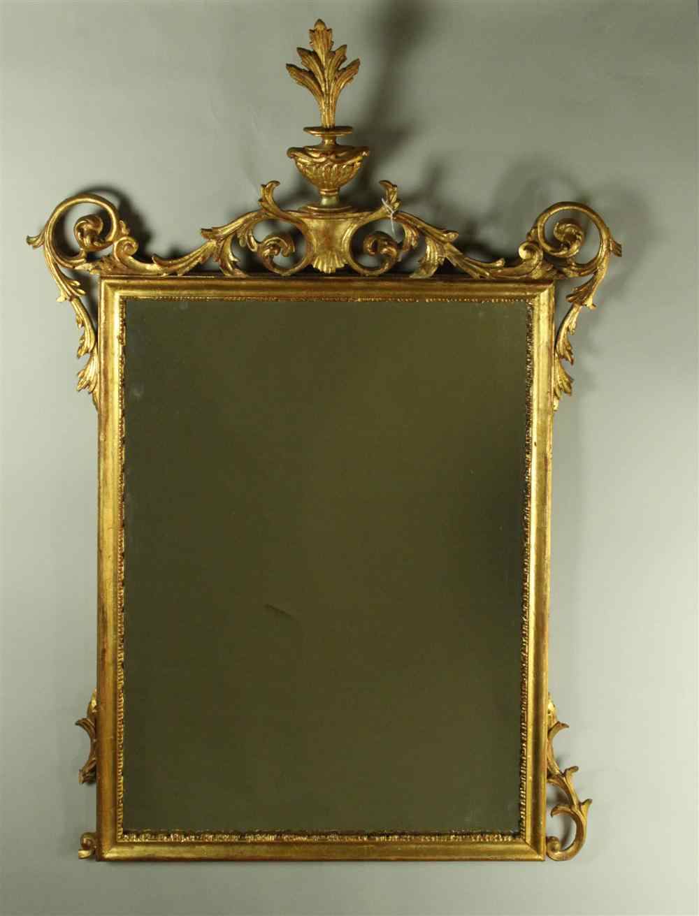 Appraisal: RECTANGULAR MIRROR SURROUNDED BY SCROLLWORK AND URN WITH LEAF ON