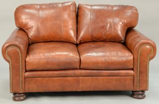 Appraisal: Braddington three piece leather set including two loveseats and an