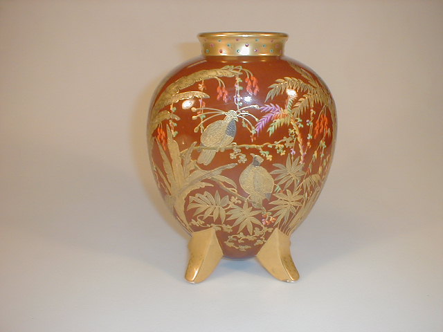 Appraisal: A Limoges pottery flask vase with a gilded neck rim