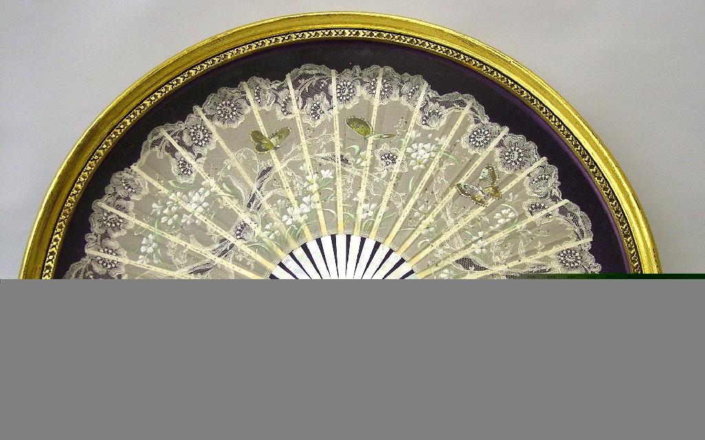 Appraisal: Glazed cased fan with foliate lace and hand painted decorations