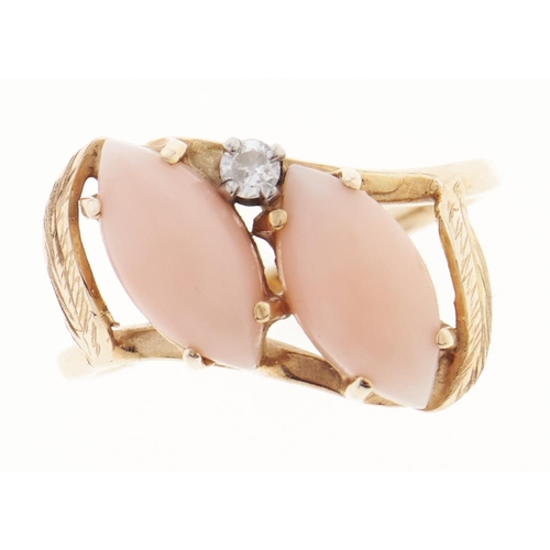 Appraisal: A coral and diamond ring in gold marked K g