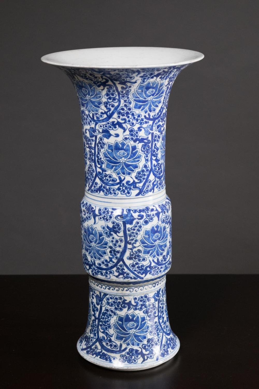 Appraisal: CHINESE BLUE AND WHITE PORCELAIN VASE of gu form hand