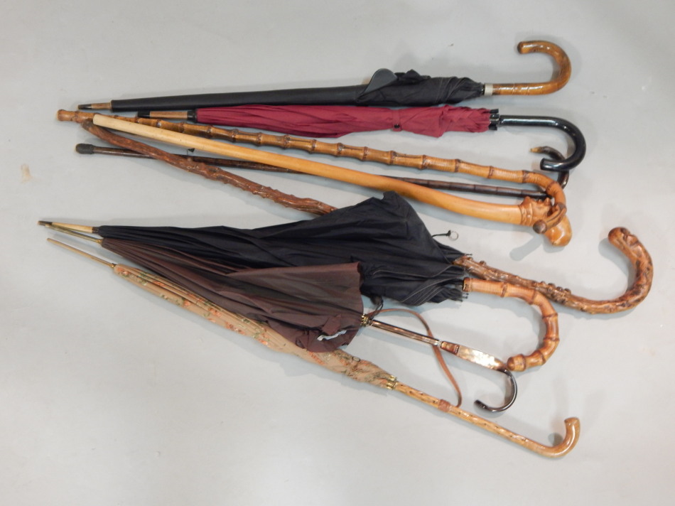 Appraisal: Various umbrellas parasols and walking sticks etc to include a