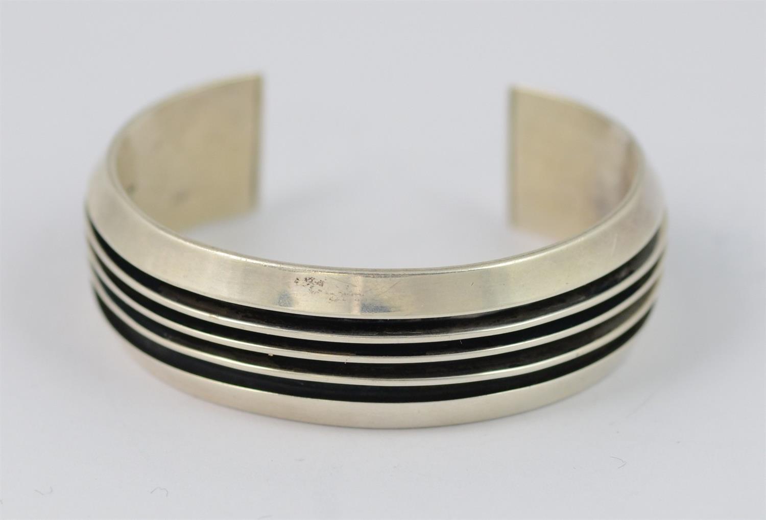 Appraisal: Tim Yazzie Navajo sterling railroad style cuff bracelet h x