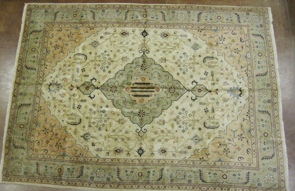 Appraisal: A Tabriz Carpet with stylised motifs central lozenge on a