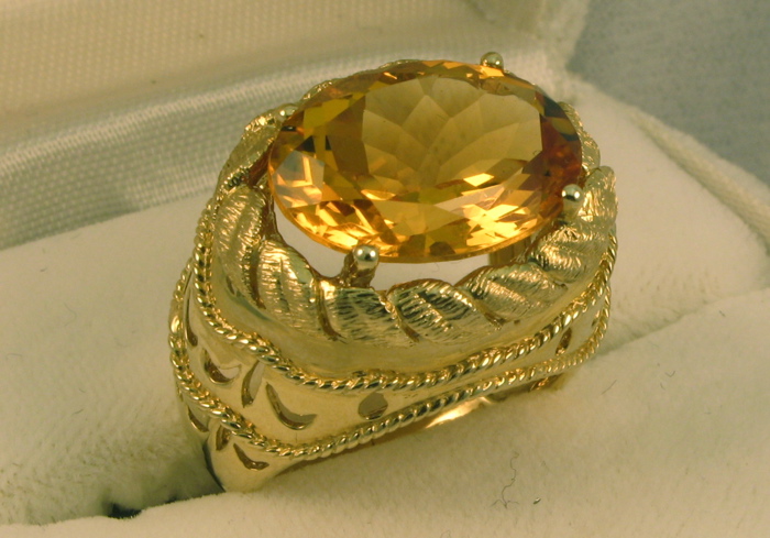 Appraisal: CITRINE AND FOURTEEN KARAT GOLD RING set with a large