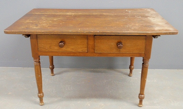 Appraisal: - Pennsylvania walnut tavern table c with a cleated two-board