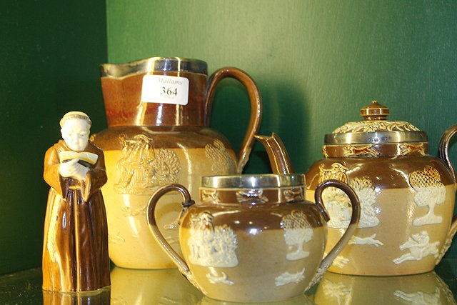 Appraisal: A DOULTON STONE WARE TEAPOT with silver rim a jug