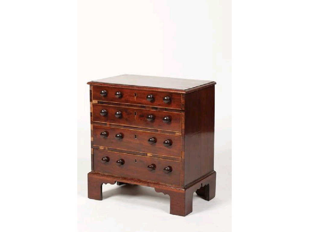 Appraisal: A REGENCY MAHOGANY AND ROSEWOOD CROSSBANDED COLLECTORS CHEST the rectangular