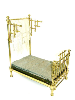 Appraisal: A miniature late Victorian brass half tester bedstead with turned