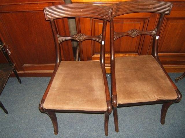 Appraisal: A set of four mahogany Regency chairs with drop in