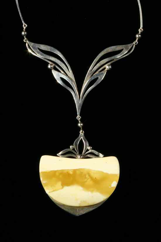 Appraisal: CUSTOM-MADE SILVER AND PALE AMBER CONTEMPORARY DESIGN PENDANT NECKLACE Slender