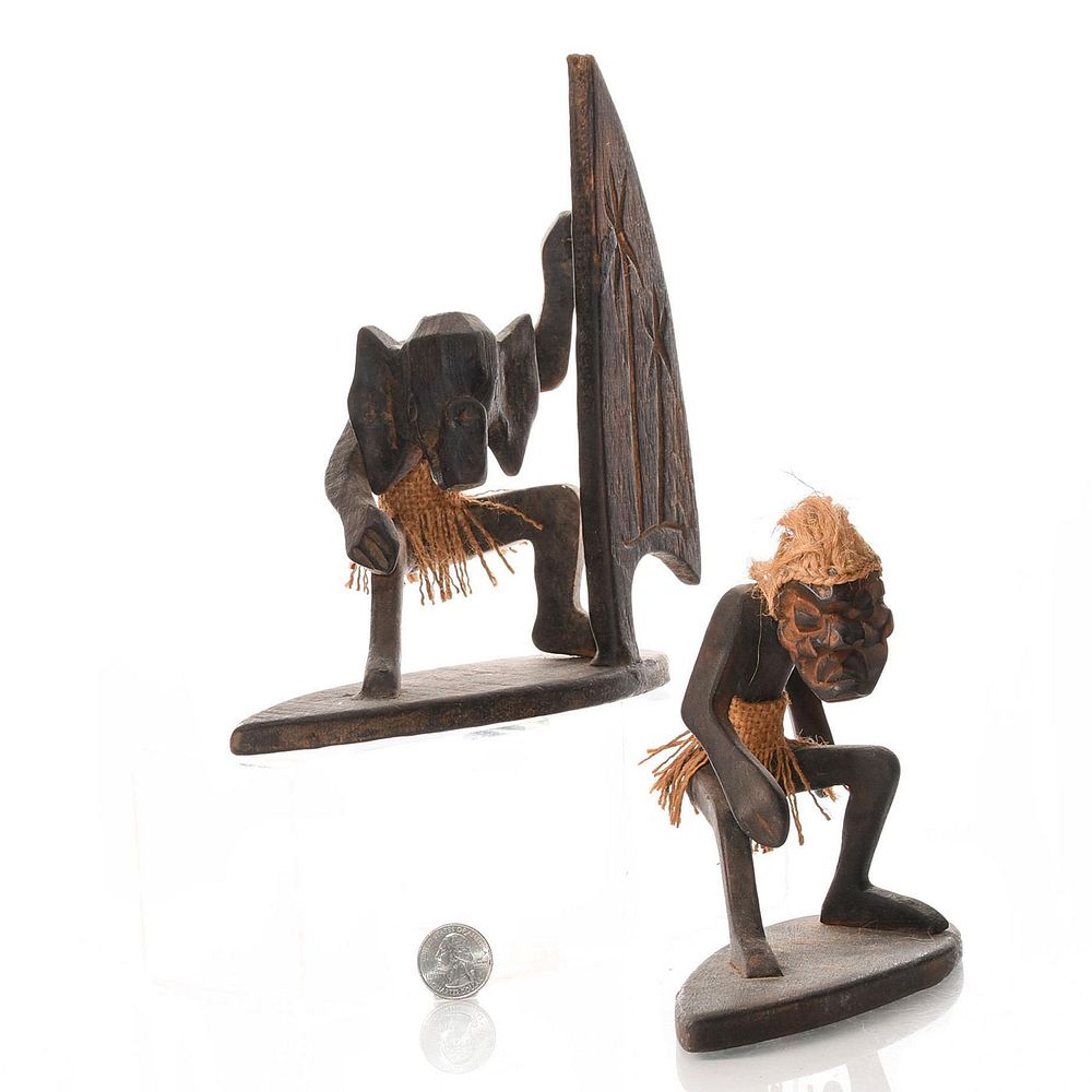 Appraisal: AFRICAN TRIBAL SURFING FIGURES WITH MASKS holding air sail wearing