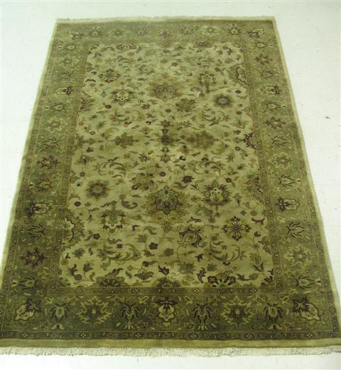 Appraisal: BEIGE AND GREEN RUG in x in