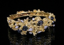 Appraisal: A Contemporary Ladies' Bracelet with Diamonds and Black Star Sapphires