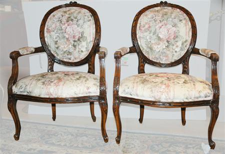 Appraisal: Pair of Louis XVI Style Walnut Fauteuils Estimate -