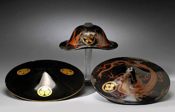 Appraisal: Three lacquer decorated jingasa Edo Period The first a bajo-gasa