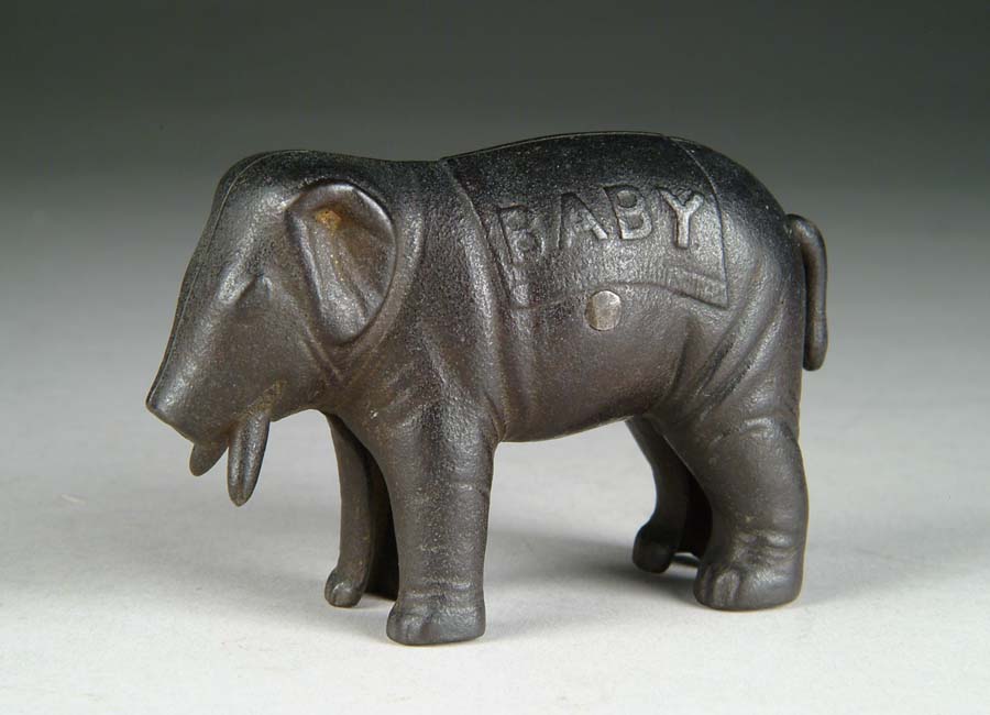 Appraisal: CAST IRON ELEPHANT W EMBOSSED BABY ON SIDE BY IVES