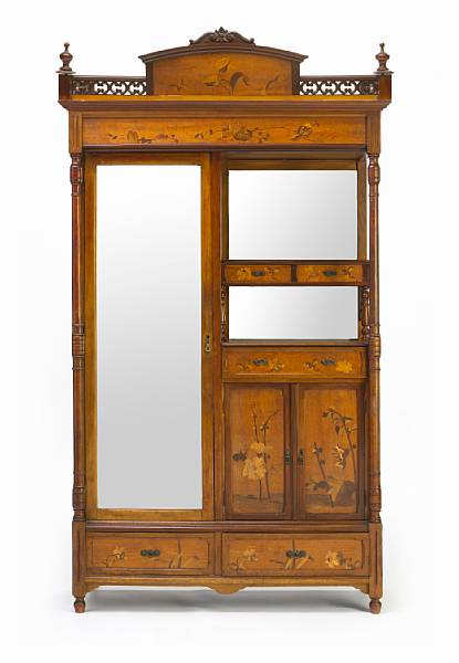 Appraisal: An Art Nouveau marquetry inlaid walnut cabinet produced in the