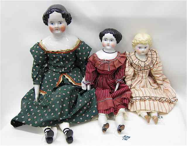 Appraisal: THREE TH CENTURY CHINA HEAD DOLLS with cloth bodies two